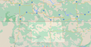 What towns are in Daniels County